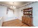 Charming dining room featuring hardwood floors and a wood hutch at 1526 N Cherokee N Rd, Social Circle, GA 30025