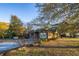 Brick house with a porch and mature trees at 1526 N Cherokee N Rd, Social Circle, GA 30025