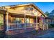 Front porch with rocking chairs and American flag at 1526 N Cherokee N Rd, Social Circle, GA 30025