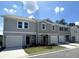 New townhome development showcasing three-unit building with attached garages at 301 Hynes Sw Dr, Villa Rica, GA 30180