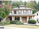 Two-story house with front porch and landscaped yard at 2439 Muirfield Pl, Atlanta, GA 30337