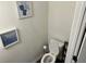 Simple half bathroom with toilet and decorative framed artwork at 2680 Senegal Way # 88, Atlanta, GA 30331