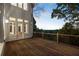 Spacious deck with wooden flooring and scenic wooded views at 8380 Sentinae Chase Dr, Roswell, GA 30076