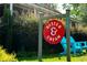 Ice cream shop storefront with red and white sign and blue chairs at 8380 Sentinae Chase Dr, Roswell, GA 30076