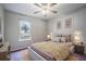 Cozy bedroom with ceiling fan, plush carpeting, and comfortable bed at 10490 Plantation Bridge Dr, Alpharetta, GA 30022