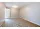 Empty bonus room with patterned flooring and a door at 10490 Plantation Bridge Dr, Alpharetta, GA 30022