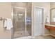 Spacious primary bathroom with a glass-enclosed shower, soaking tub, and dual vanities at 2013 Hidden Aly, Alpharetta, GA 30009