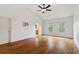 Large main bedroom with hardwood floors and ceiling fan at 2013 Hidden Aly, Alpharetta, GA 30009