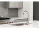 Modern kitchen sink and faucet on a white quartz countertop at 2327 Mason Dr # D23, Atlanta, GA 30316