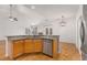 Kitchen island with granite countertops and stainless steel dishwasher at 5065 Winship Ct, Alpharetta, GA 30009