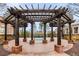 Brick patio with wooden pergola and bench at 5065 Winship Ct, Alpharetta, GA 30009