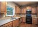 Kitchen with stainless steel appliances and wood cabinets at 1177 Preserve Park Dr, Loganville, GA 30052