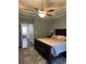 Spacious Primary bedroom with king bed and access to porch at 1250 Olympic Dr, Oxford, GA 30054