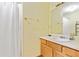 Clean bathroom with shower/tub combo, vanity, and mirror at 3185 Tia Nw Ct, Kennesaw, GA 30152