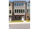 Front view of a townhome, featuring stone and neutral colors at 3784 Jack Vernon Cir, Powder Springs, GA 30127