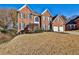 Large front yard with mature trees and shrubs at 1881 Waltham Cir, Marietta, GA 30062