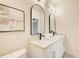 Elegant bathroom with double vanity, marble countertops, and arched mirrors at 5190 Holland Ct, Dunwoody, GA 30338