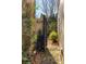 Inviting brick pathway leads to a private backyard with gated entry and lush greenery at 9129 Selborne Ln, Chattahoochee Hills, GA 30268