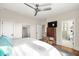 King bedroom with ensuite bathroom and hardwood floors at 9129 Selborne Ln, Chattahoochee Hills, GA 30268