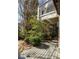 Charming deck overlooks a wooded backyard, providing a peaceful outdoor space at 9129 Selborne Ln, Chattahoochee Hills, GA 30268