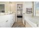 Bright bathroom with double vanity and a view into the bedroom at 113 Glenmore Ln, Mcdonough, GA 30253