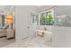 Elegant bathroom with soaking tub, walk-in shower, and marble flooring at 336 Mont Harmony Sw Rd, Powder Springs, GA 30127
