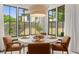 Breakfast nook with round table and chairs, and large windows at 336 Mont Harmony Sw Rd, Powder Springs, GA 30127