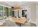 Elegant dining room with wood table and light fixture at 336 Mont Harmony Sw Rd, Powder Springs, GA 30127