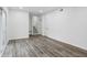Finished basement with grey wood-look flooring and plenty of natural light at 4051 Glenda Dr, College Park, GA 30337