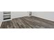 Finished basement room with grey vinyl flooring and built-in shelving at 4051 Glenda Dr, College Park, GA 30337