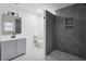 Modern bathroom with grey tile shower, grey vanity, and marble floor at 4051 Glenda Dr, College Park, GA 30337