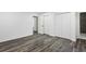 Spacious bedroom with grey flooring, double closets and access to hallway at 4051 Glenda Dr, College Park, GA 30337
