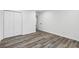 Well-lit bedroom, featuring grey vinyl flooring and double door closet at 4051 Glenda Dr, College Park, GA 30337