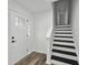 Modern entryway with staircase and white door at 4051 Glenda Dr, College Park, GA 30337