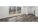 Bright living room featuring hardwood floors and large windows at 4051 Glenda Dr, College Park, GA 30337