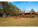 Covered pavilion with picnic tables and a playground at 1077 Mainstreet Valley Dr, Stone Mountain, GA 30088