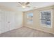 Well-lit bedroom with ceiling fan and double-door closet at 2130 Cooper Lakes Dr, Grayson, GA 30017