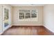 Bright dining room with hardwood floors and large window at 2130 Cooper Lakes Dr, Grayson, GA 30017