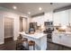 Modern kitchen with white cabinets, island, and stainless steel appliances at 126 Henley St, Canton, GA 30114