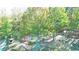 Aerial view showcasing the home's setting in a wooded area at 2230 Old Fountain Rd, Lawrenceville, GA 30043