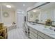 Elegant bathroom with double vanity, large mirror, and a corner bathtub at 2230 Old Fountain Rd, Lawrenceville, GA 30043