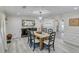 Bright dining room with a wooden table and six chairs at 2230 Old Fountain Rd, Lawrenceville, GA 30043
