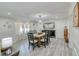 Bright dining room with a wooden table and six chairs at 2230 Old Fountain Rd, Lawrenceville, GA 30043