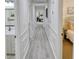 Bright hallway with wainscoting and wood-look flooring at 2230 Old Fountain Rd, Lawrenceville, GA 30043