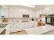 White kitchen with stainless steel appliances and ample counter space at 2230 Old Fountain Rd, Lawrenceville, GA 30043