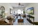 Spacious living room featuring a comfortable sectional sofa and large TV at 2230 Old Fountain Rd, Lawrenceville, GA 30043