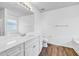 Bright bathroom featuring white vanity, toilet, and bathtub at 3648 Silver Springs Ct, Decatur, GA 30034