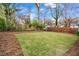 Large backyard with grassy area and mature trees at 1097 Hubbard Sw St, Atlanta, GA 30310