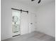 Bedroom with an en-suite bathroom and barn door at 1097 Hubbard Sw St, Atlanta, GA 30310