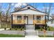 Charming craftsman home features a front porch, freshly landscaped lawn, and modern exterior finishes at 1097 Hubbard Sw St, Atlanta, GA 30310